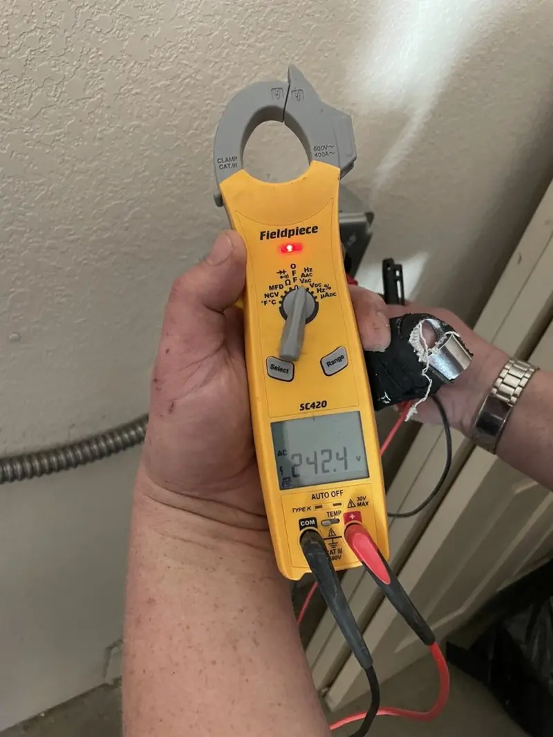 Voltage testing with clamp meter during Ceiling Fan Installation in New Orleans
